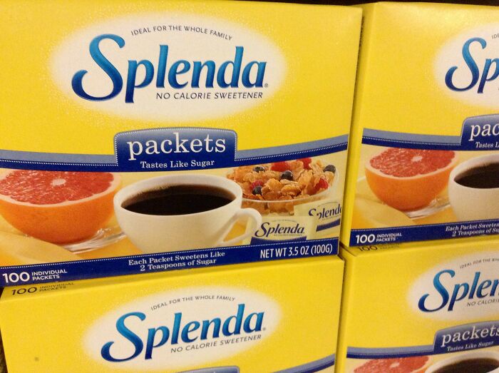 Boxes of Splenda sweetener packets on display.