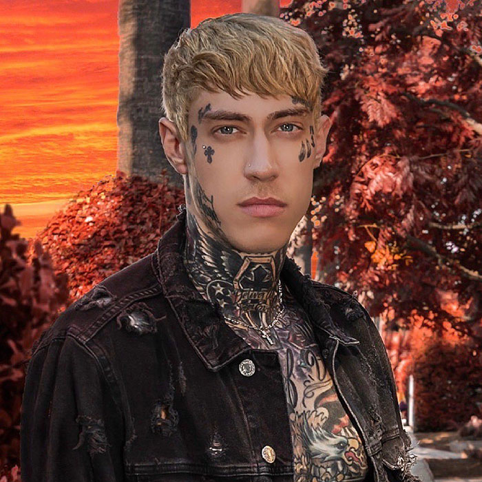 Man with tattoos outdoors at sunset, wearing a black denim jacket; related to Miley Cyrus and Billy Ray Cyrus topic.