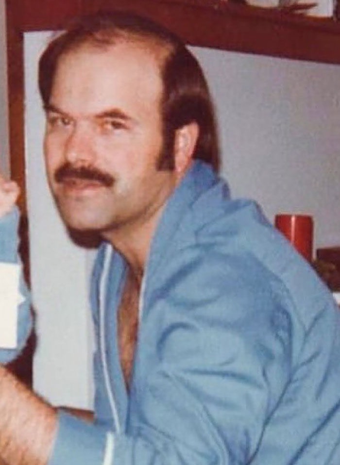 Person in blue clothing, associated with true crime cases, smiling in a casual indoor setting.