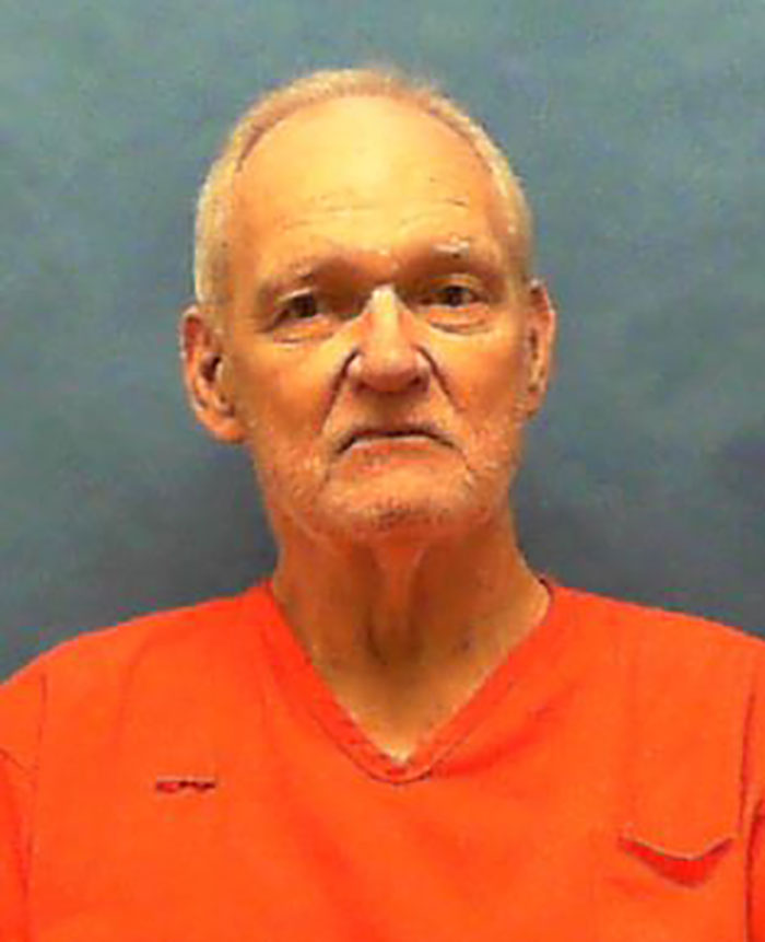 Elderly man in an orange prison jumpsuit, illustrating true crime case plot twists.