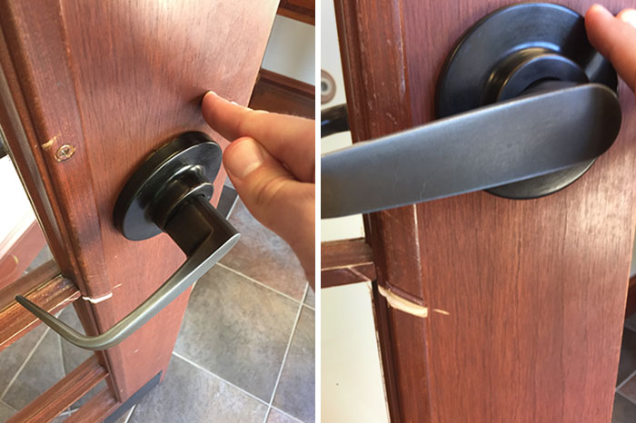 Close-up of a door with misaligned handles, showcasing unfortunate public interior design.