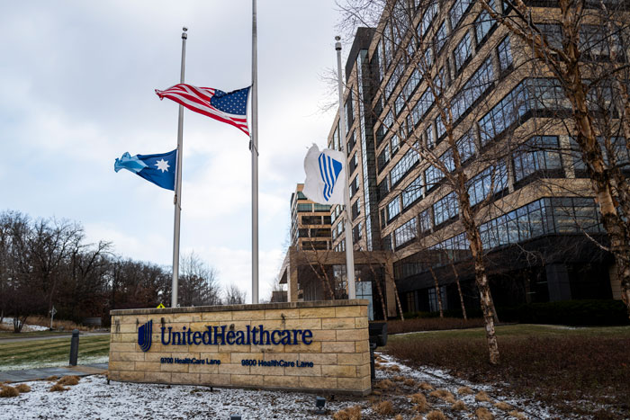 UnitedHealth headquarters with flags at half-mast, symbolizing a major $63 billion market value loss.