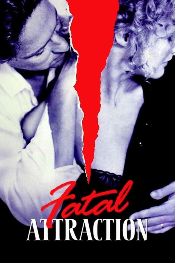 Close-up of a movie poster for "Fatal Attraction" with a dramatic red tear between two characters, representing nostalgia films.