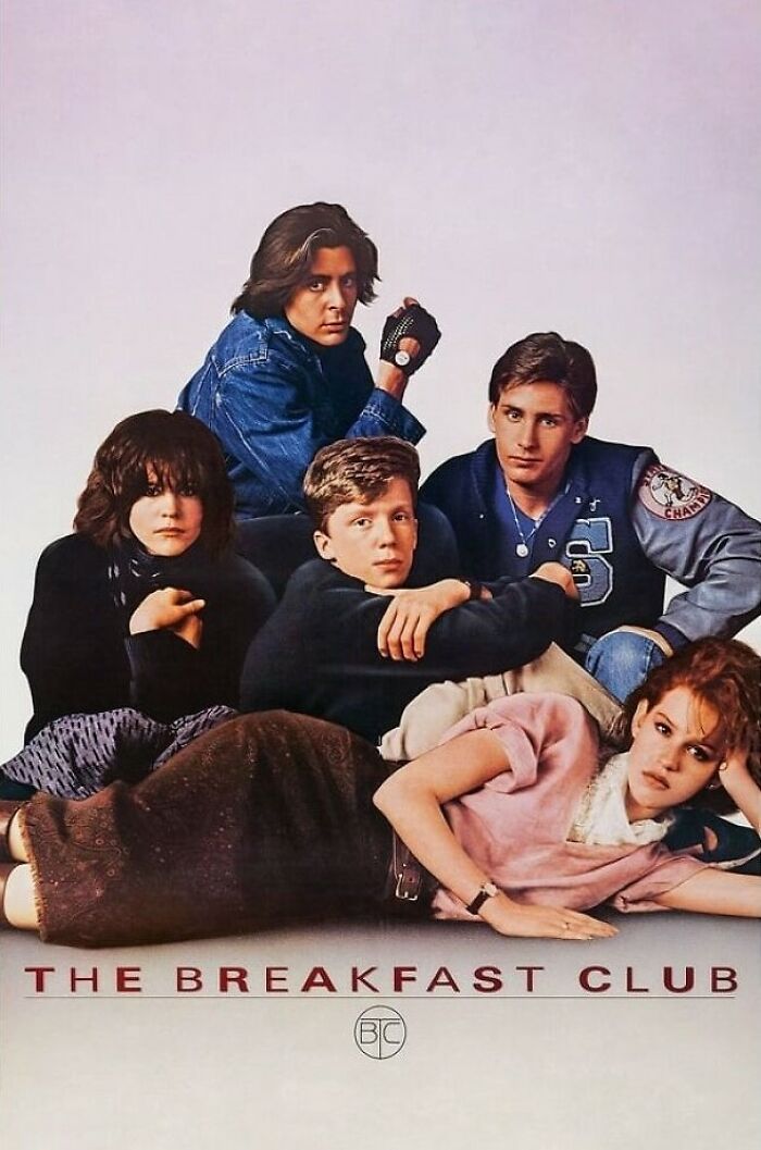 Group of teenagers sitting and lying down, iconic 80s scene from a popular nostalgia movie.