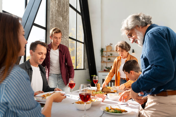 Family gathered around a dining table, reflecting on fixing attitudes and relationships.