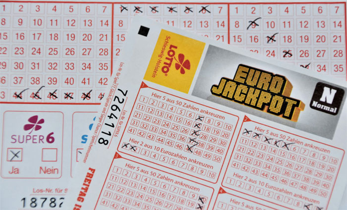 Euro Jackpot lottery ticket with winning numbers marked.