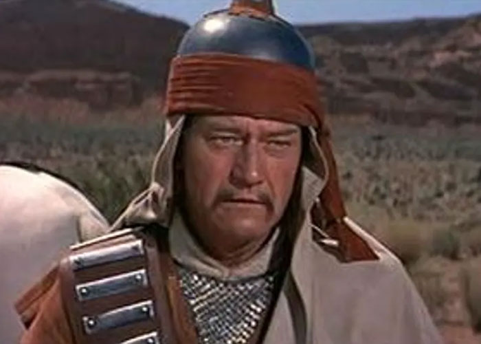 Actor in historical warrior costume in a desert scene, related to film snobs' debate on worst Hollywood casting choices.