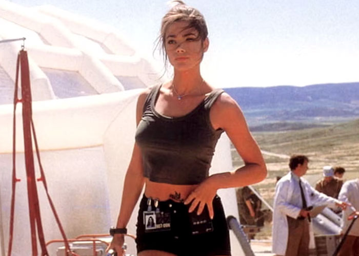 Woman in a cropped tank top outdoors in a cinematic setting, relevant to film casting discussions.