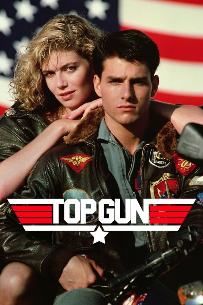 Actors in flight jackets with an American flag backdrop, from a classic nostalgia movie.