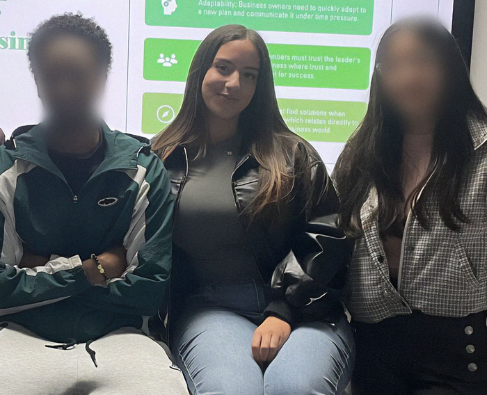 Young woman with friends, related to denied breast reduction story for back pain.