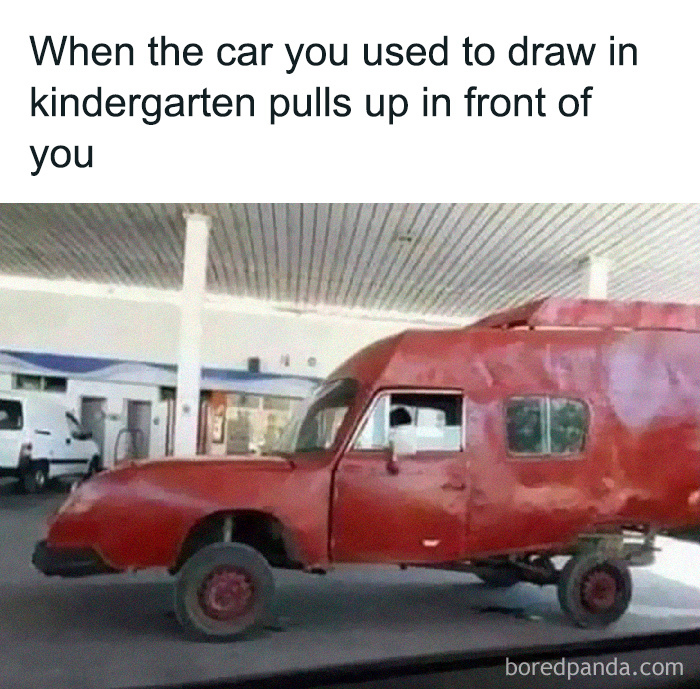 Red car with a humorous, boxy design parked at a gas station, highlighting dad's humor.