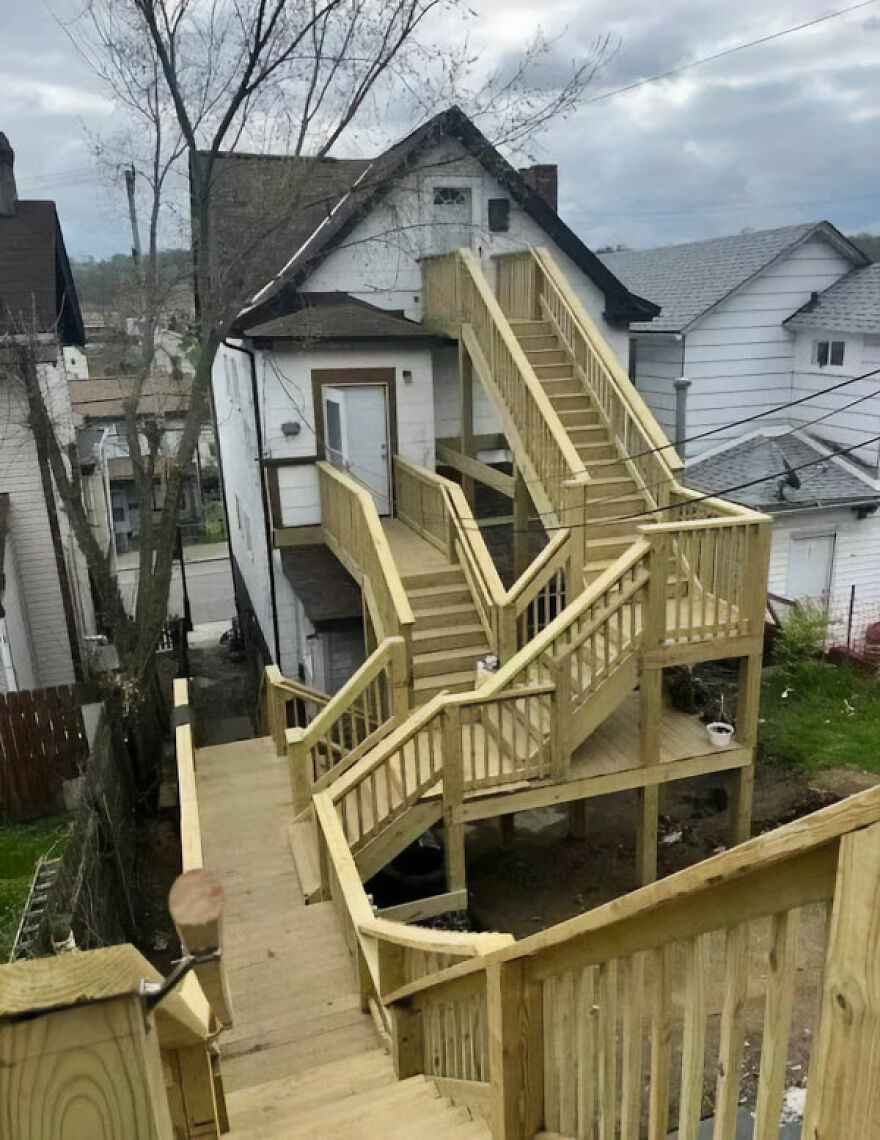 Unusual wooden staircase structure attached to a house, illustrating architecture shaming.