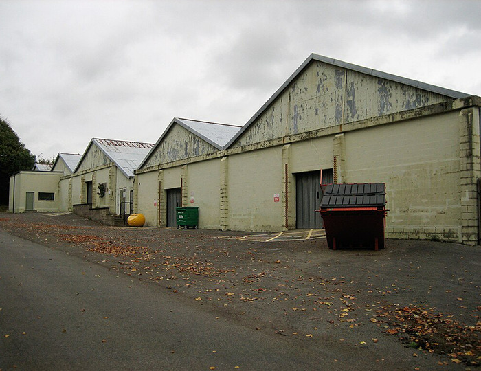 Warehouse exterior at a military base, representing location related to soldier's body discovery.