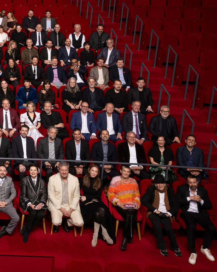 Group of 2025 Oscars nominees sitting in theater chairs.