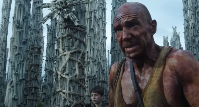 Scene from 28 Years Later with a man looking distressed amidst dystopian surroundings.