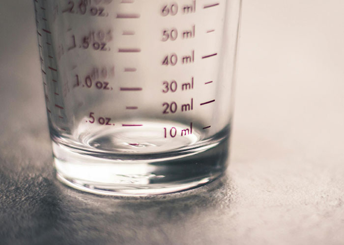 Close-up of a measuring glass, illustrating culture shocks with food portion sizes in Europe.