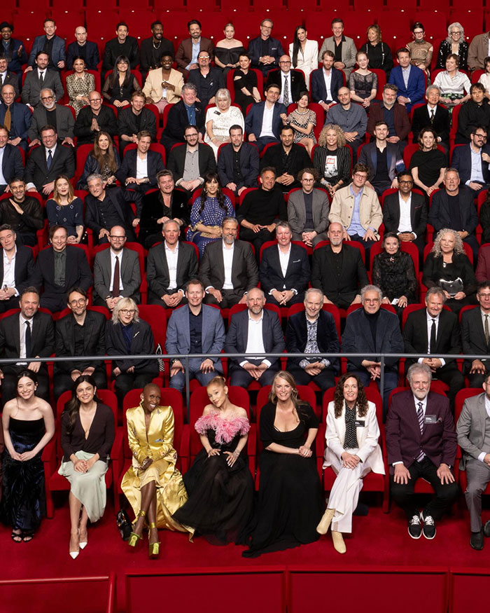 Group of 2025 Oscars nominees seated in a theater, sparking diversity discussions.