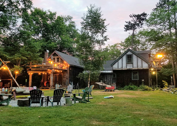 Rustic backyard with chairs and string lights, symbolizing personal space and independence.