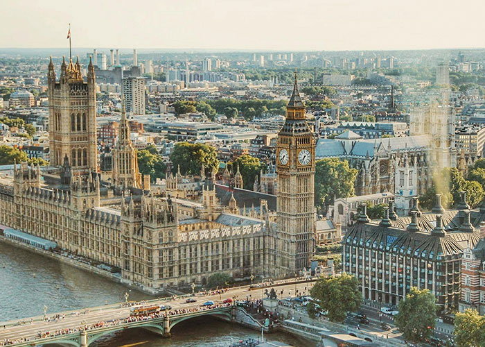 London's iconic Big Ben and Houses of Parliament on a clear day, showcasing European architecture and culture.