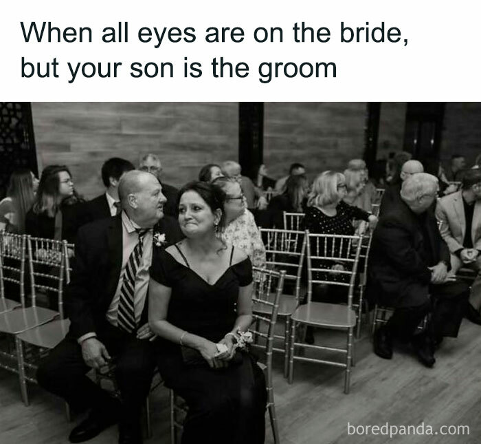 Wedding guests seated, smiling woman in black dress with flowers, showing heartwarming moment at the ceremony.