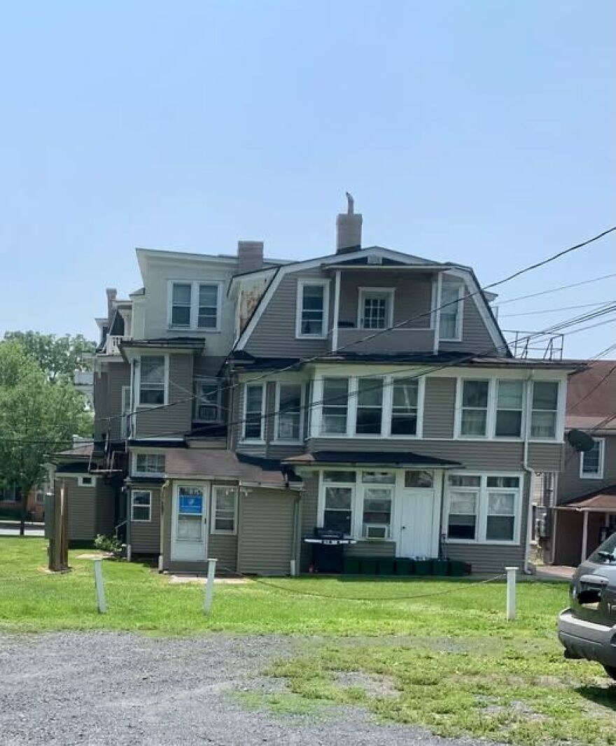 Unusual architectural design of a building with mismatched structures.