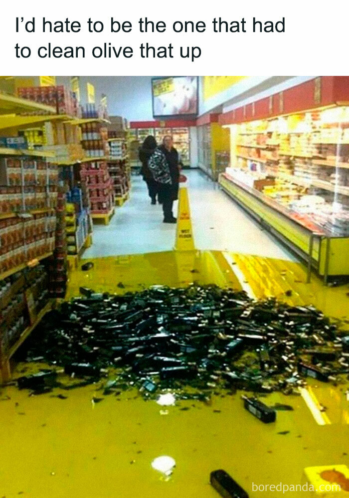 Spilled olive oil bottles in a grocery aisle, creating a challenging cleanup for those who love to cook.