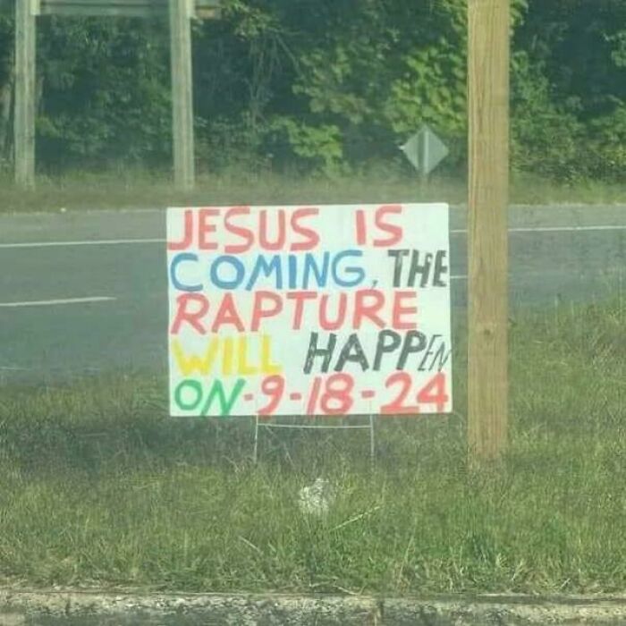 Aged prediction sign about the rapture occurring on 9-18-24 displayed by the roadside.