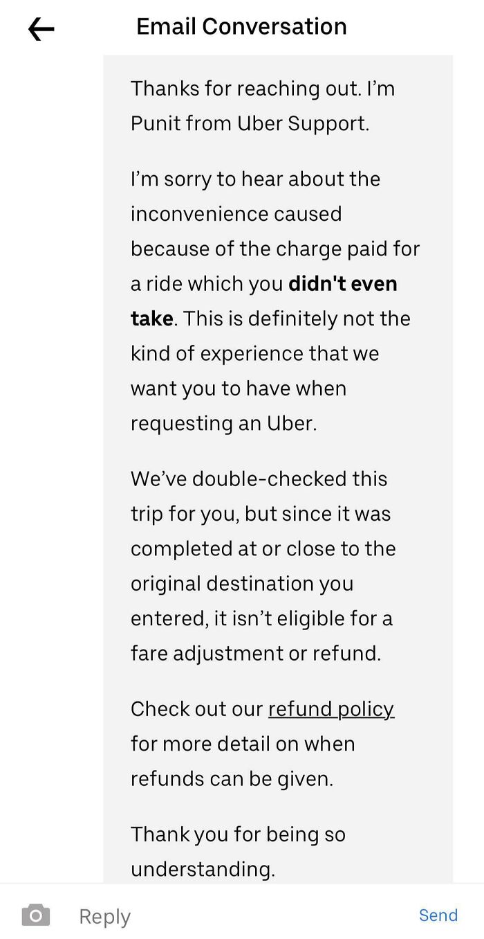 Chat support email with infuriating reply about a ride charge, not eligible for refund despite complaint.