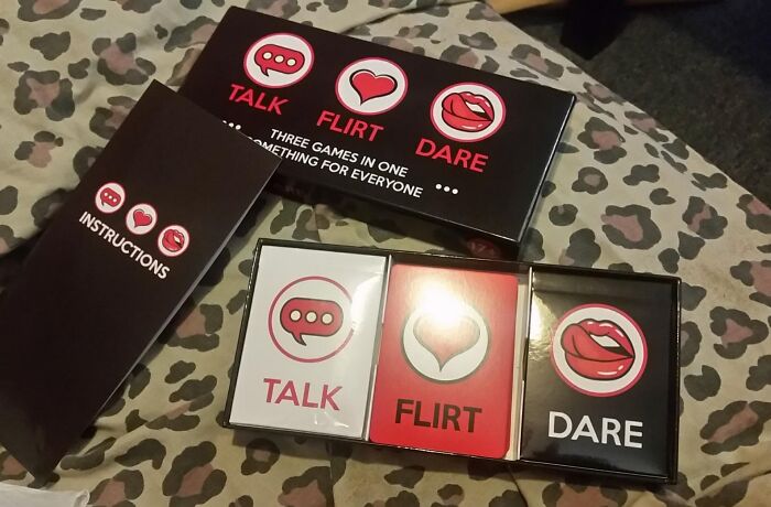 Valentine's Day gift: Talk, Flirt, Dare card game set on a patterned surface.