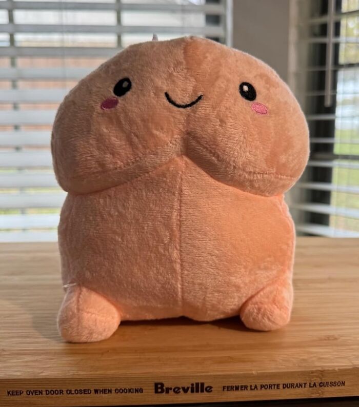 Cute plush toy with a smiling face, a hilarious Valentine's Day gift idea.