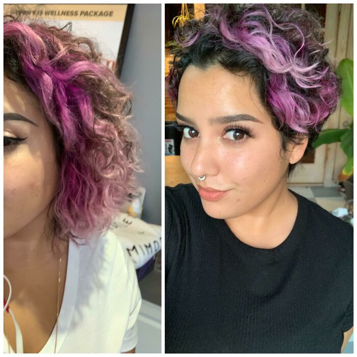 Person with a daring new haircut, featuring short, curly hair dyed in vibrant purple shades.