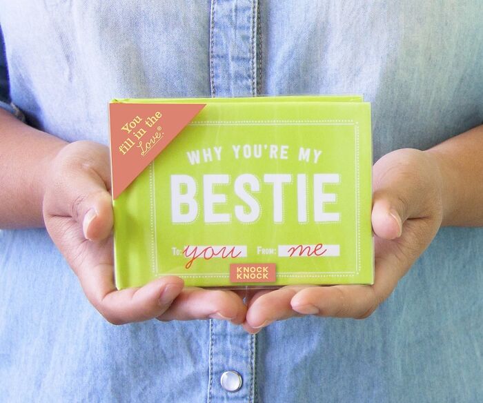 Person holding a green "Why You're My Bestie" book, a perfect Galentines Day gift.