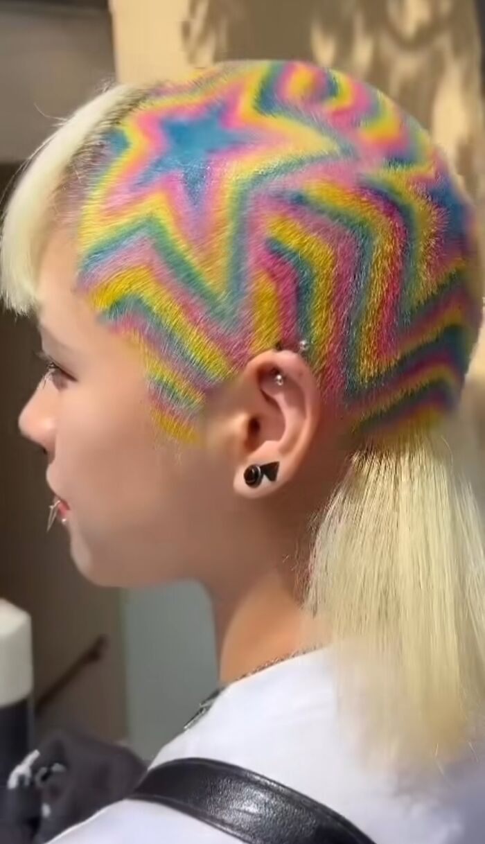 Person with colorful zigzag pattern hair, showcasing a unique hair fail.