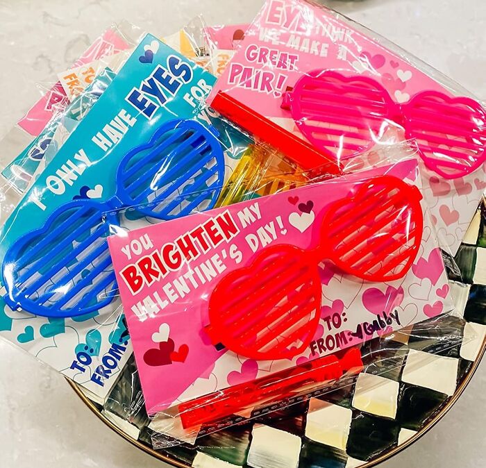 Valentine's Day gifts for kids featuring colorful heart-shaped sunglasses and playful cards.