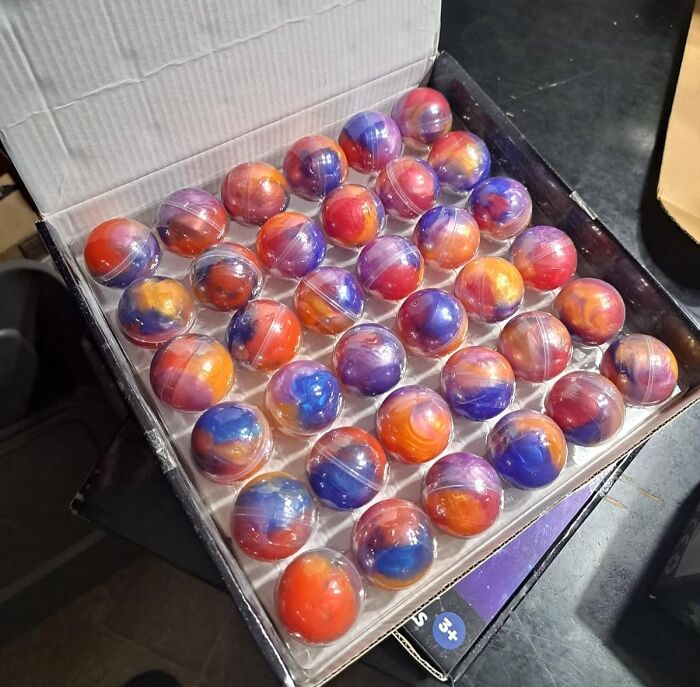 Colorful bouncy balls in a box, great Valentine's Day gifts for kids.