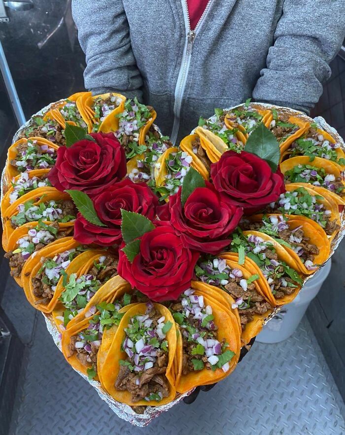 Heart-shaped taco platter with red roses, a cute Valentine’s Day-related inspiration for gifts.