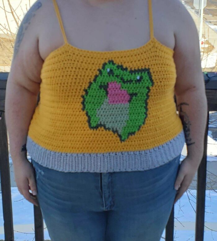 Crocheted yellow tank top with a green frog design, ideal Valentine’s Day inspiration for gifts.