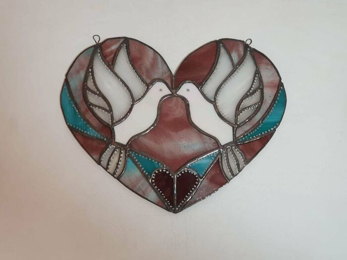 Stained glass heart with two white doves, a cute Valentine’s Day gift inspiration.