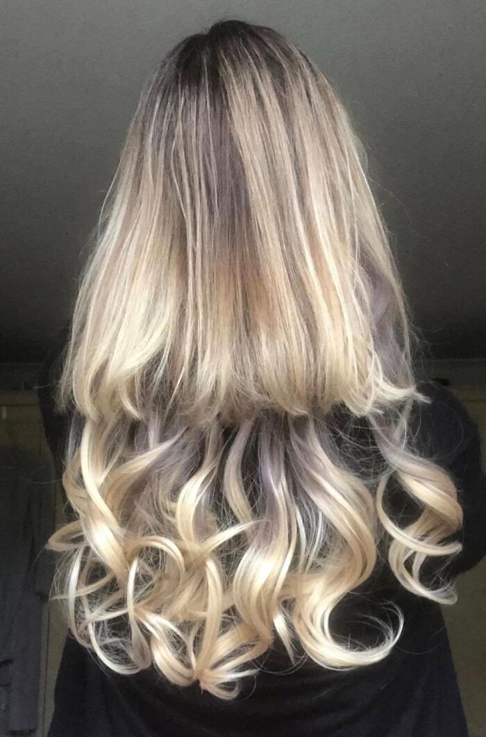 Blonde hair with uneven dark roots, showcasing a hair fail.