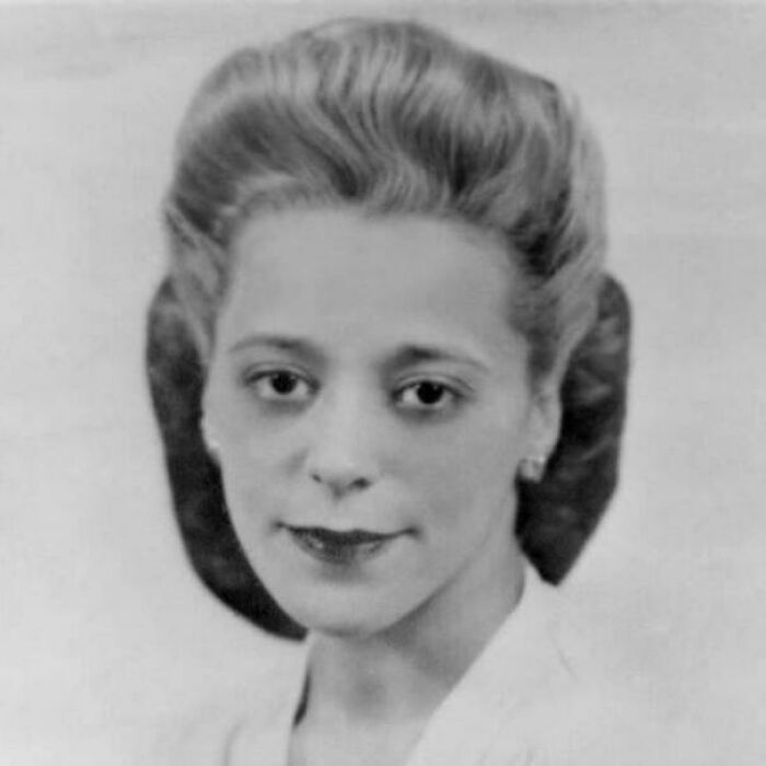 Black and white portrait of a woman with a vintage hairstyle, representing interesting facts.