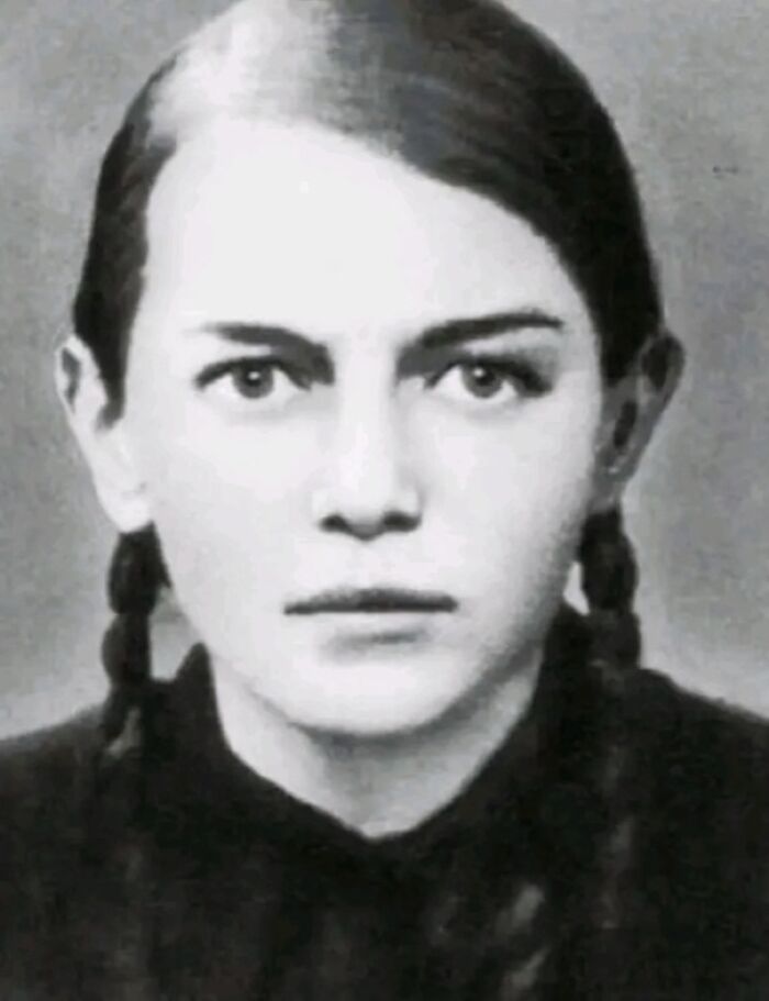 Black and white portrait of a person with two braids, representing interesting facts.