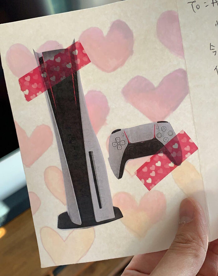 Valentine's Day card with a PS5 drawing and heart designs.