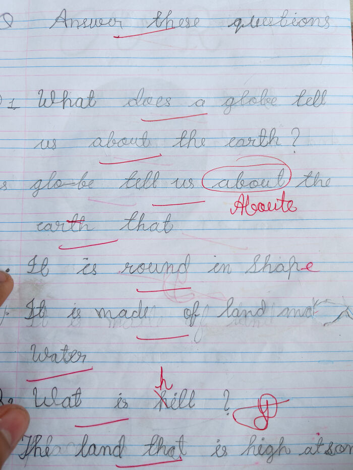 Handwritten page with teacher's corrections in red ink, illustrating bad-infuriating-teachers' feedback style.