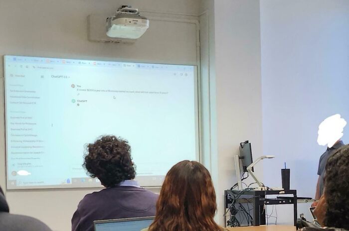 Students in a classroom, facing a lesson on the projector, potentially highlighting infuriating teaching practices.