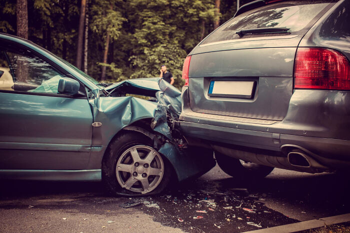 Two cars in a minor crash on a road, illustrating a potential worst first date scenario.