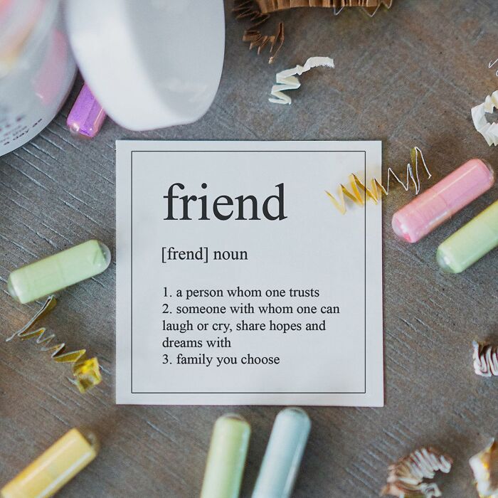 Friend definition card surrounded by colorful confetti, a perfect Galentine's Day gift idea.