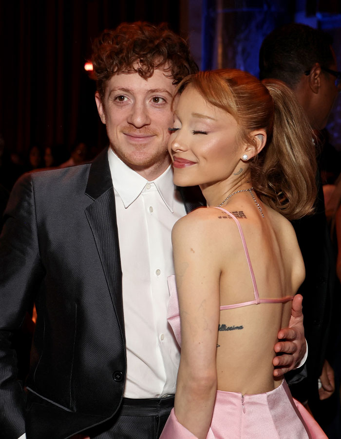 Pair posing together at Critics Choice Awards event.