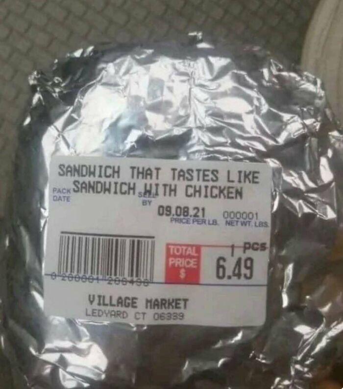 Humorous sandwich label reading "sandwich that tastes like chicken," wrapped in foil for cooking enthusiasts.