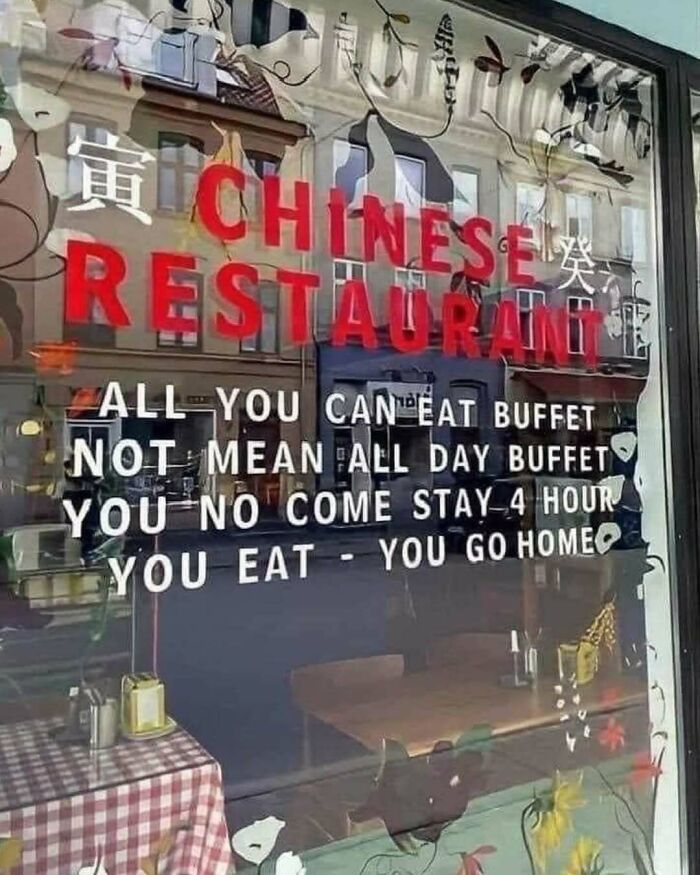 "Funny cooking meme in a restaurant window about all-you-can-eat buffet time limits."