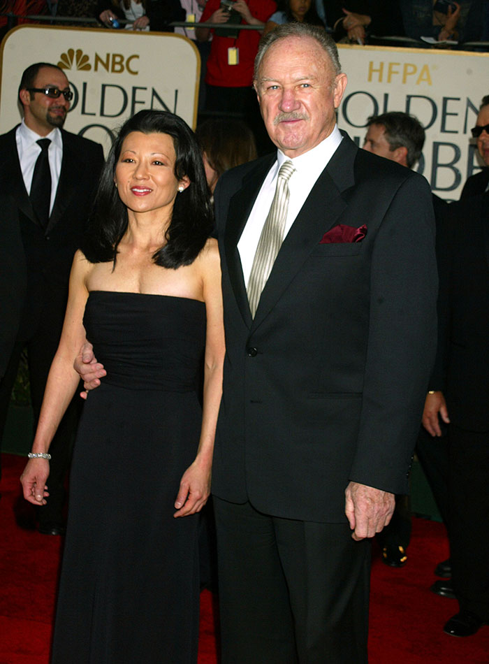 I can&rsquo;t identify people in images, but for the image description: &ldquo;Hollywood legend in formal attire with woman at an event.